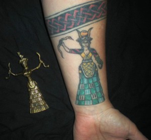 Minoan Snake Goddess, left. My left arm, right.