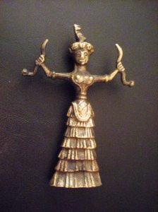 She's been found in a variety of forms and made from several types of materials.  This replica is brass.